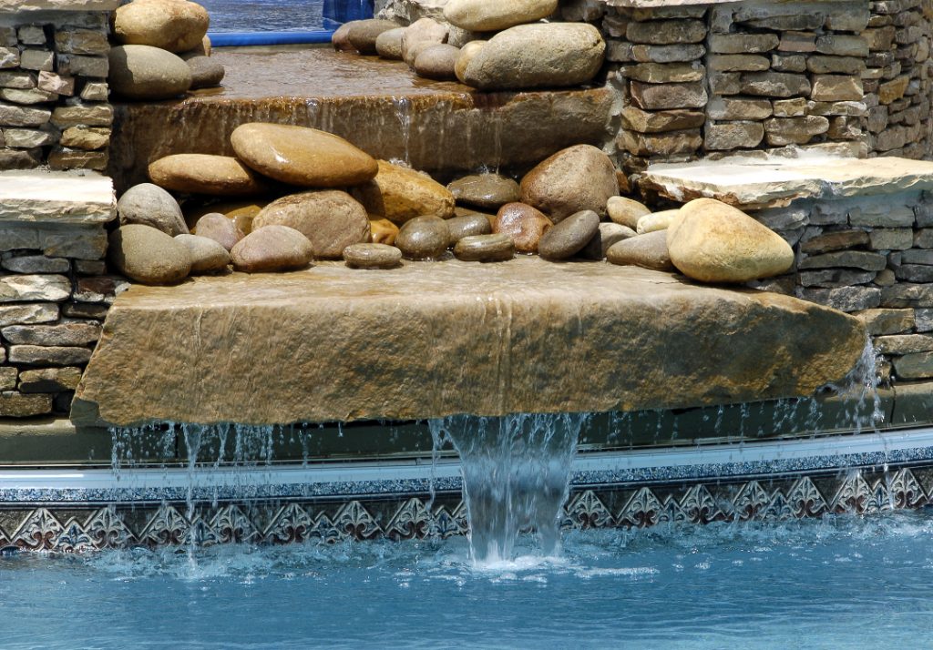 Pool water feature - tranquil stone overflow